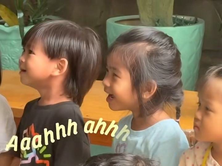 Children singing along and smiling